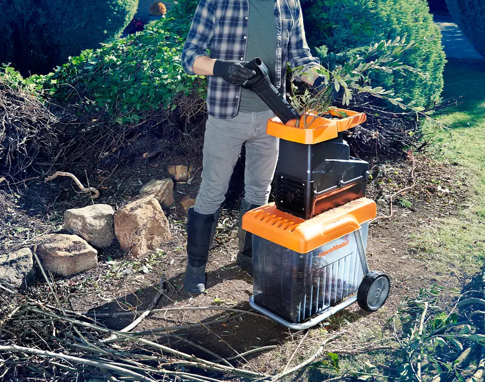 LawnMaster Quiet Shredder turning Twigs and Branches into Mulch