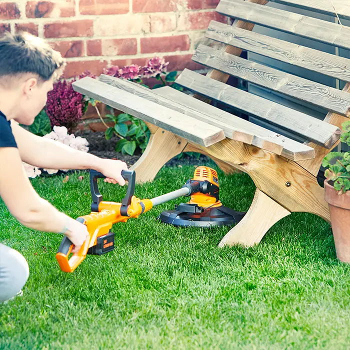 LawnMaster 25cm Trimmer under a bench