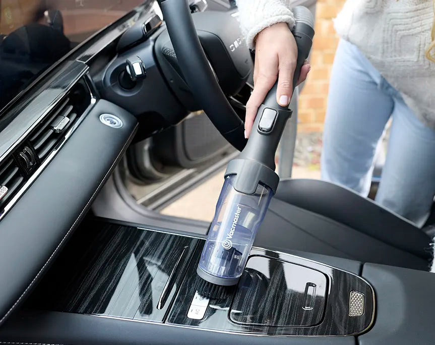 Lightweight Spot Cleaner with accessory attachment vacuuming car interior