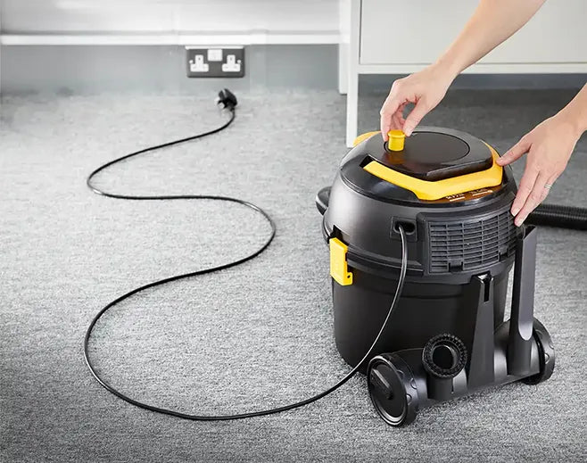 Cable being rewound on Vacmaster D8 cylinder vacuum cleaner