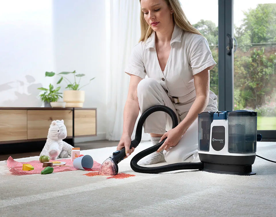 Carpet spot cleaner Vacmaster Spotlet cleaning split drink from rug with kids toys