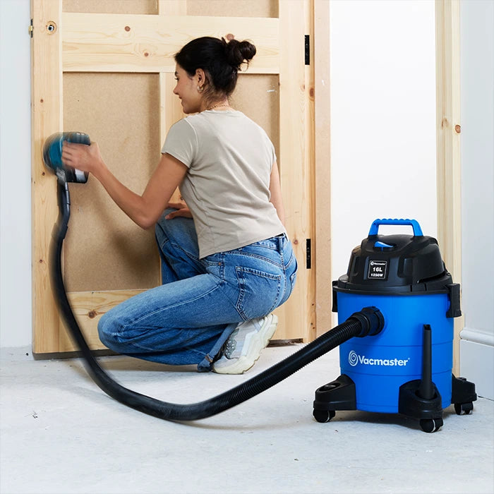 Vacmaster 16L wet and dry vacuum attached to power tool for dust extraction while sanding