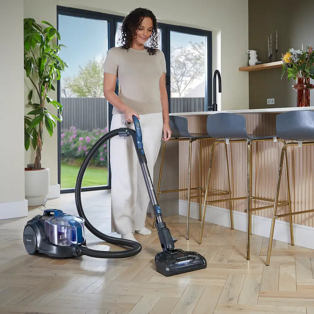 Vacmaster Vortica Cylinder Vacuum Cleaner in a UK kitchen cleaning a hard floor