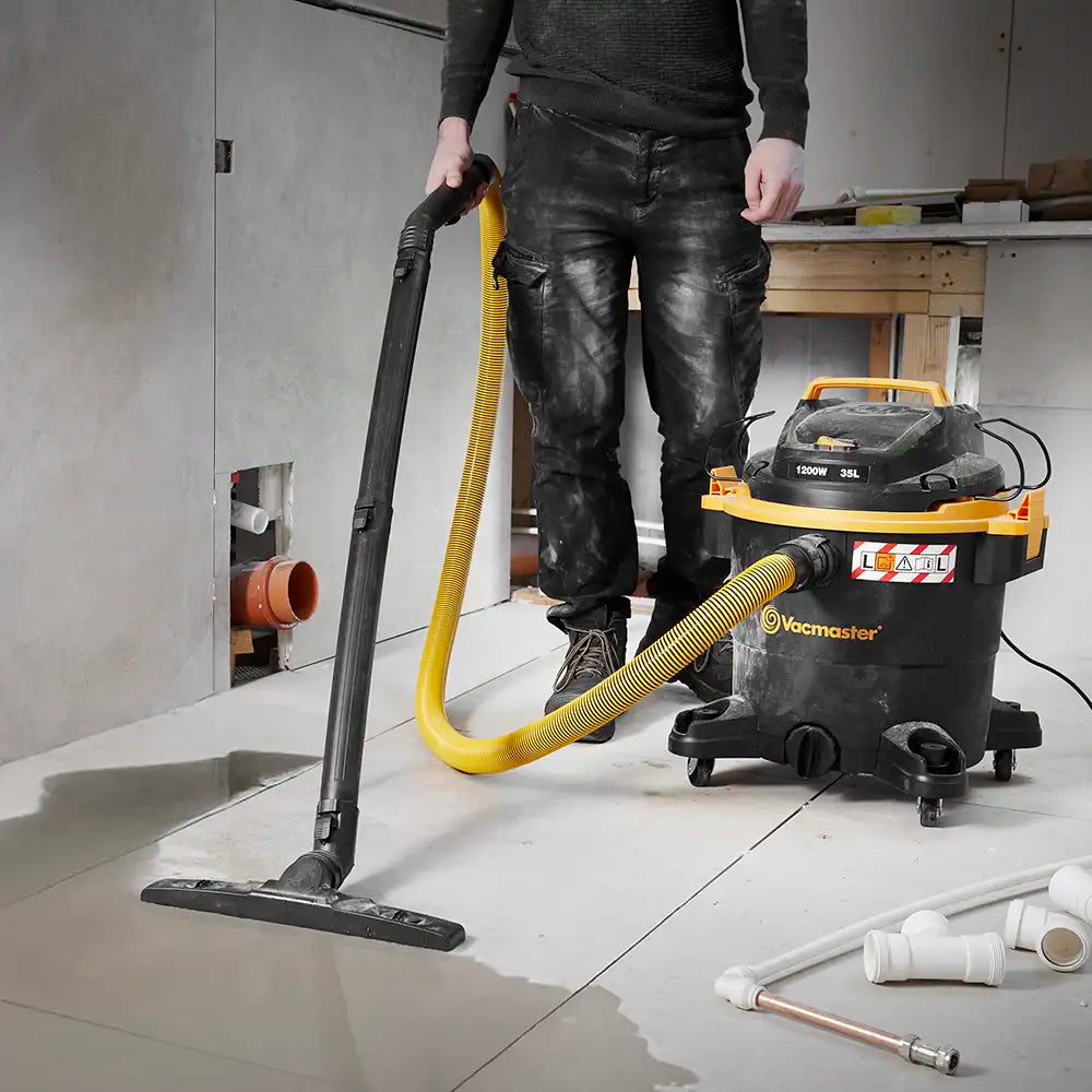 Vacmaster wet and dry dust extractor WD L35 vacuuming flood water from bathroom floor