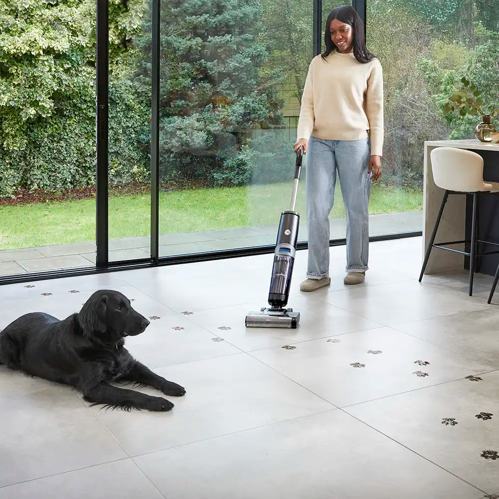 cordless hard floor cleaner vacmaster easyclean HVA cleaning muddy paws from kithen floor with dog lying on floor