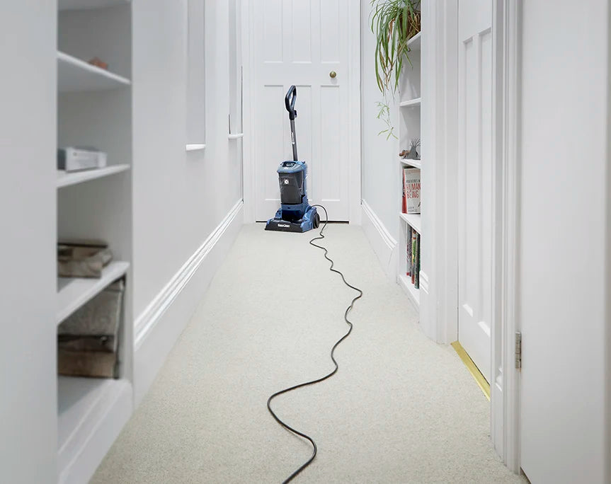 Long Reach Cable Vacmaster UCT Carpet Cleaner a
at the End of a Long Hallway in a Home