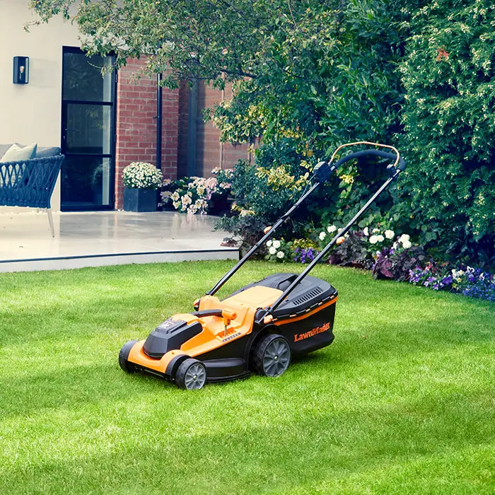 LawnMaster 37cm Cordless Lawn Mower in a UK Garden