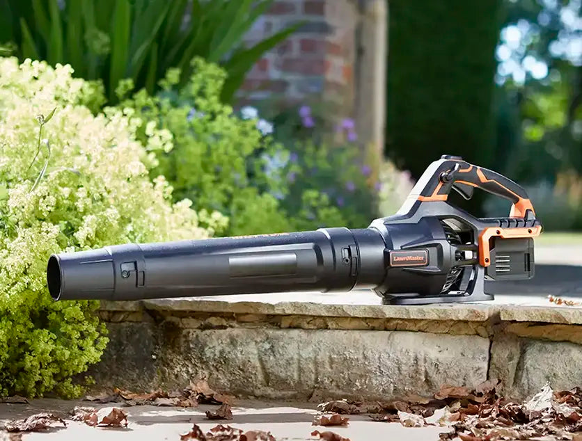 LawnMaster 48V Cordless Leaf Blower in garden on path