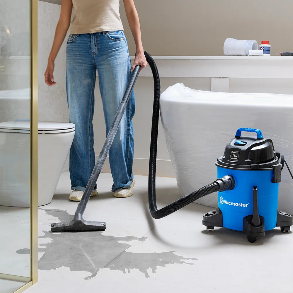 Vacmaster wet and dry vacuum cleaner removing water from bathroom floor