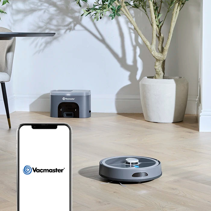 Vacmaster Robot Vacuum Cleaner in diner with Vacmaster App mobile on mobile phone