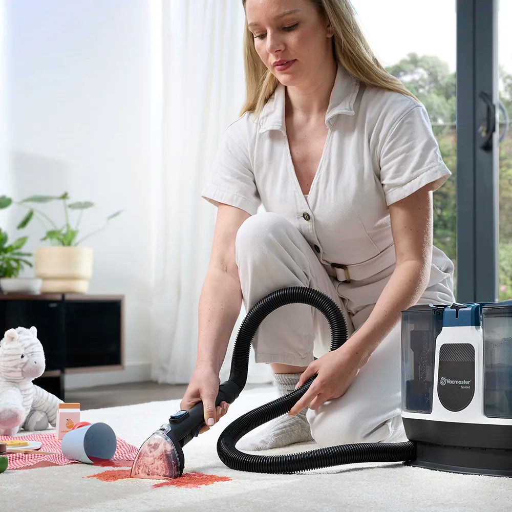 Carpet spot cleaner cleaning spilt liquid on a living room rug vacmaster Spotlet