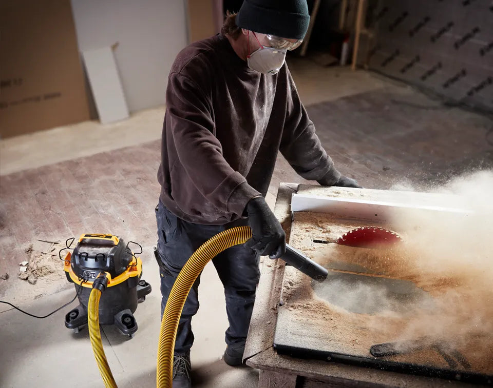 Vacmaster Blower Function Clearing Sawdust from Workbench