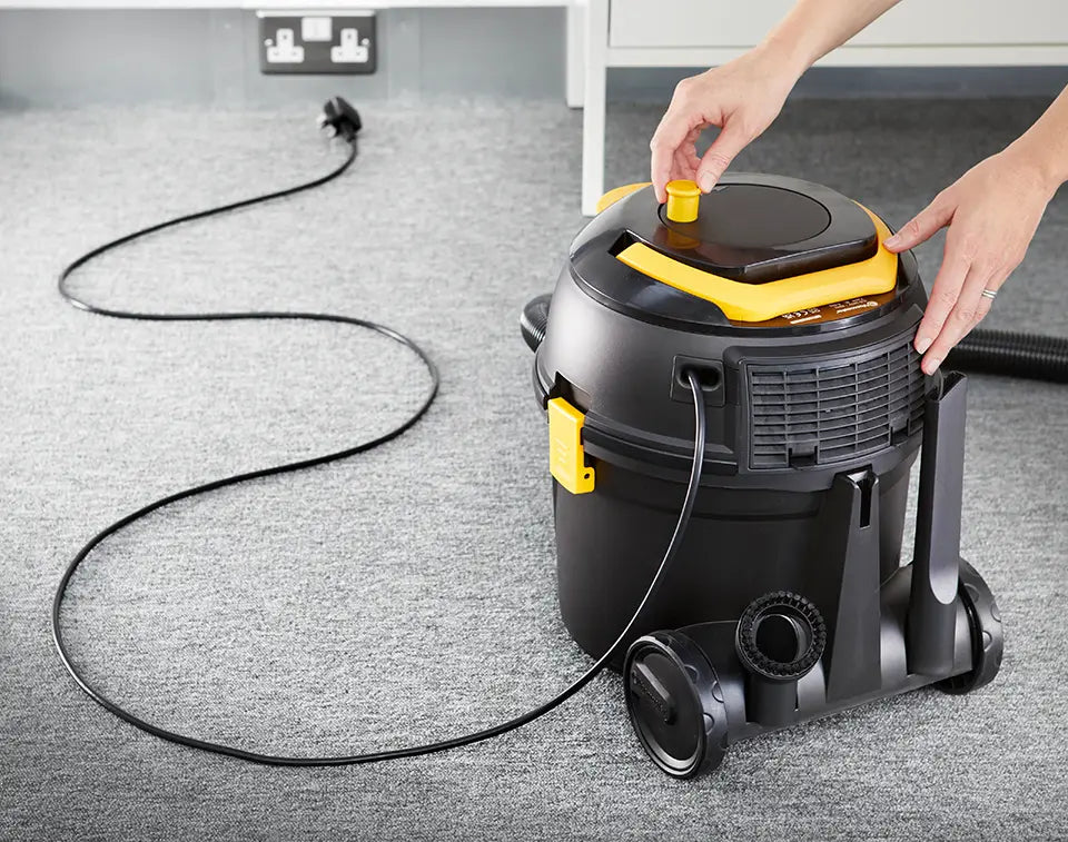 Cable being rewound on Vacmaster D8 cylinder vacuum cleaner