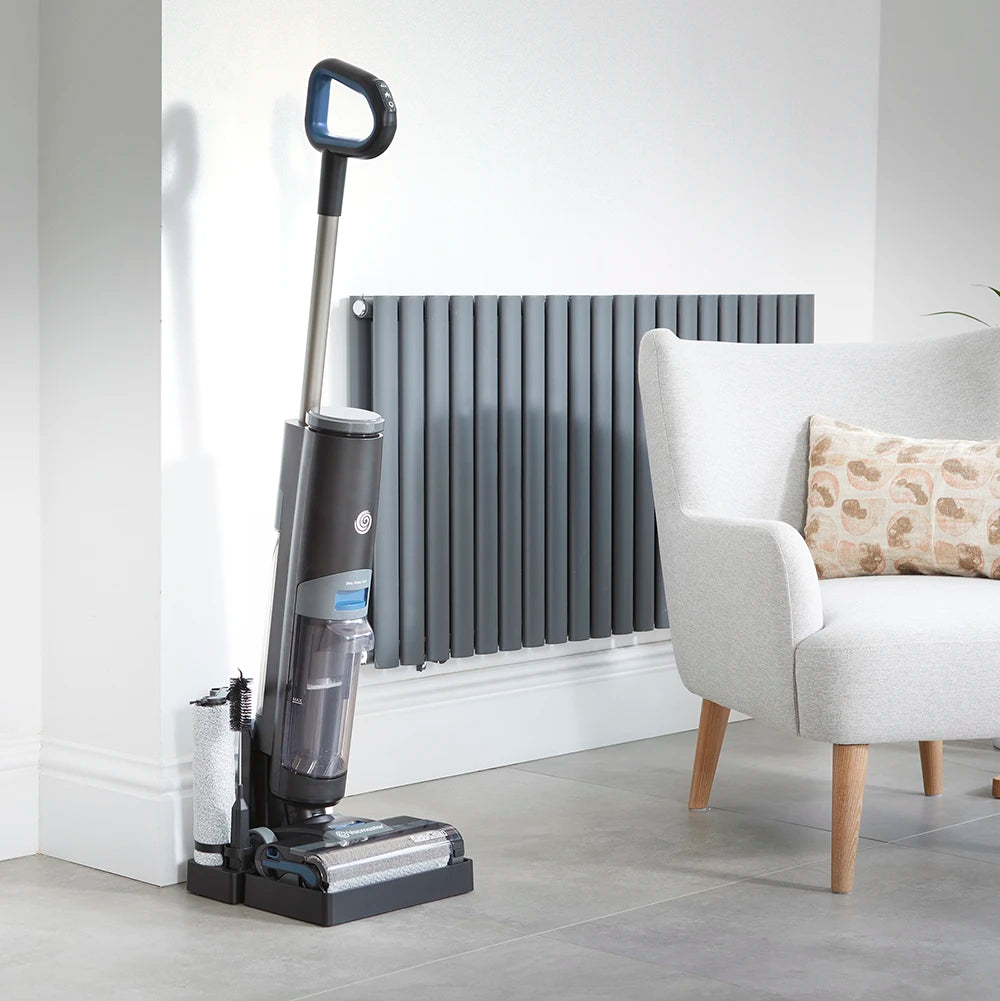 cordless hard floor cleaner Vacmaster EasyClean HVA on charging dock in open plan living room
