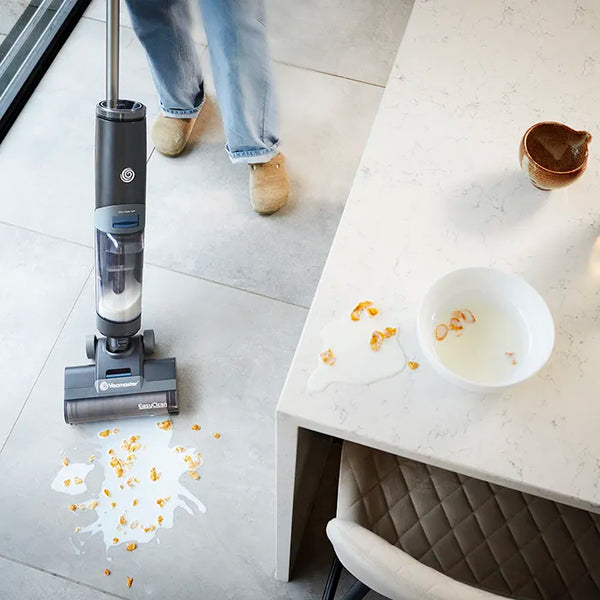 Vacmaster EasyClean HVA hard floor cleaner vacuuming, mopping and drying spilled cereal bowl from kitchen floor in one go