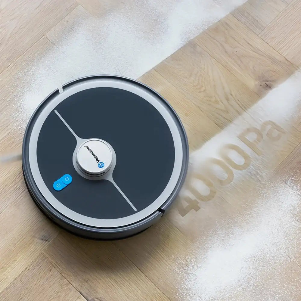 Robot vacuum cleaner Vacmaster REi vacuuming flour off floor with 400 pa letters 