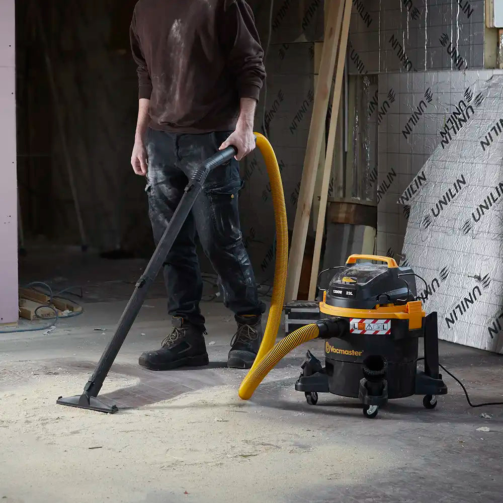 Dust Extractor on building site vacuuming sawdust Vacmaster WD L23