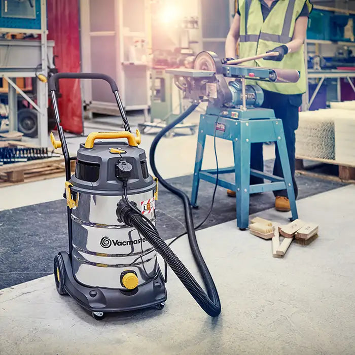 Vacuum Cleaner L Class Dust Extractor connected to industrial sander in factory