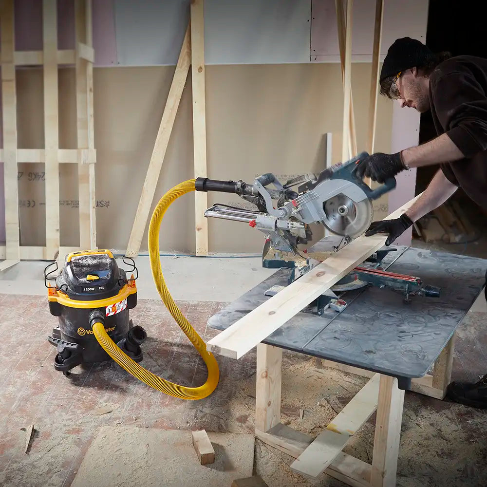 Vacmaster Wet and Dry Vacuum Cleaner extracting dust from connected table saw on building site