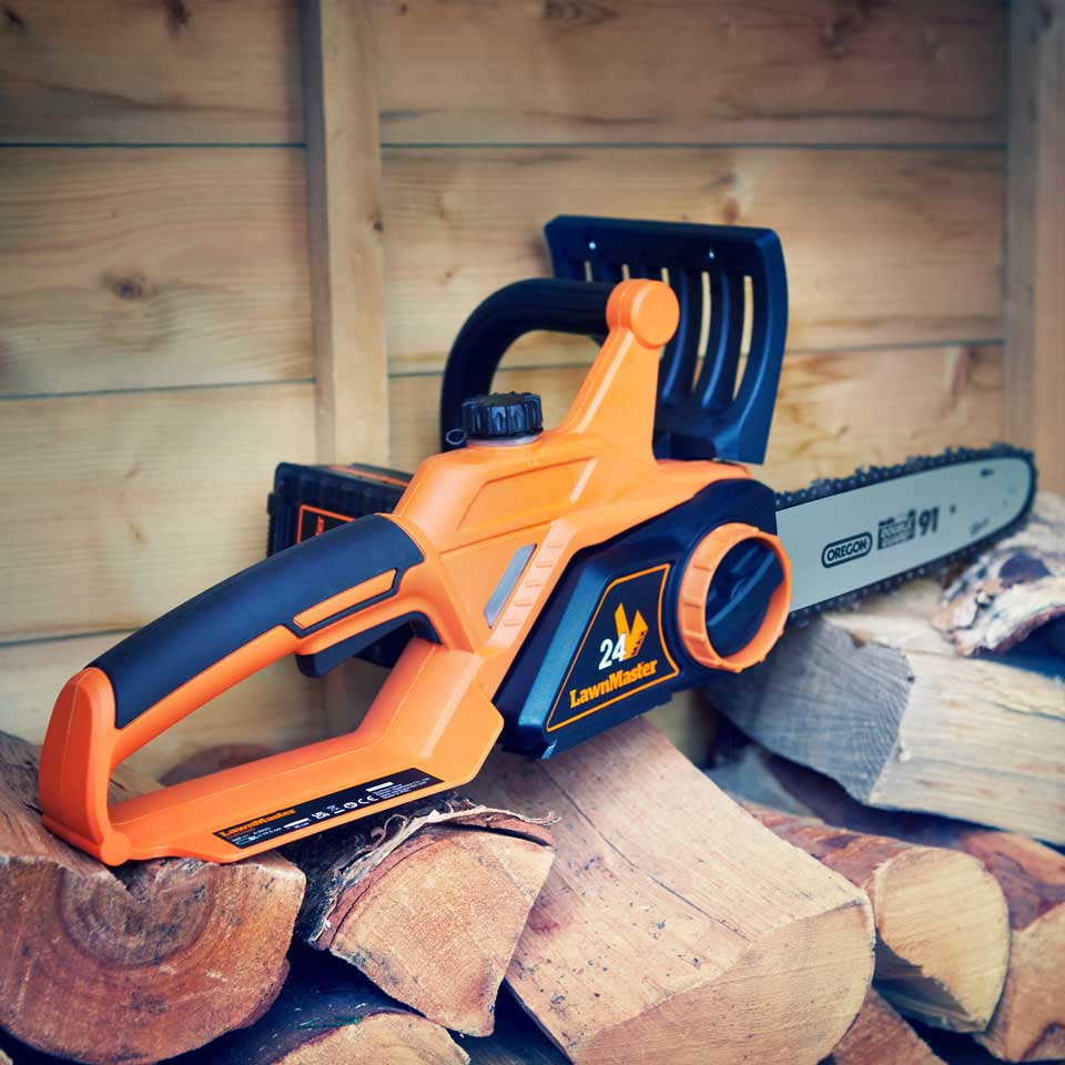 Cordless Chainsaw 24V 25cm LawnMaster in wood store