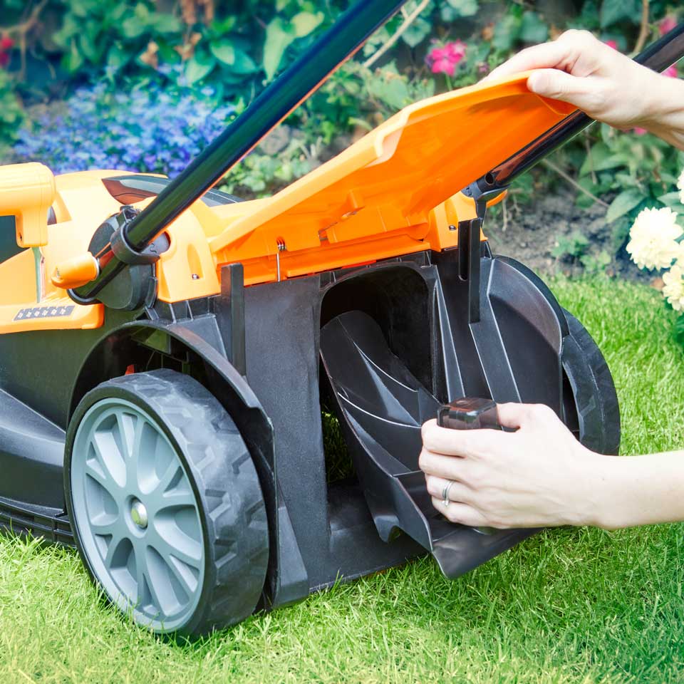 LawnMaster  Mulch Plug being fitted into 24V 37cm cordless lawn mower
