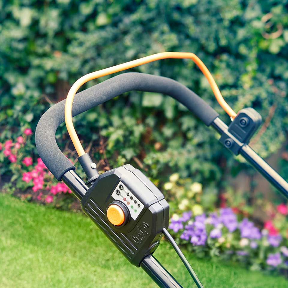 LawnMaster 24V 37cm cordless lawn mower on garden with comfort, full width handle