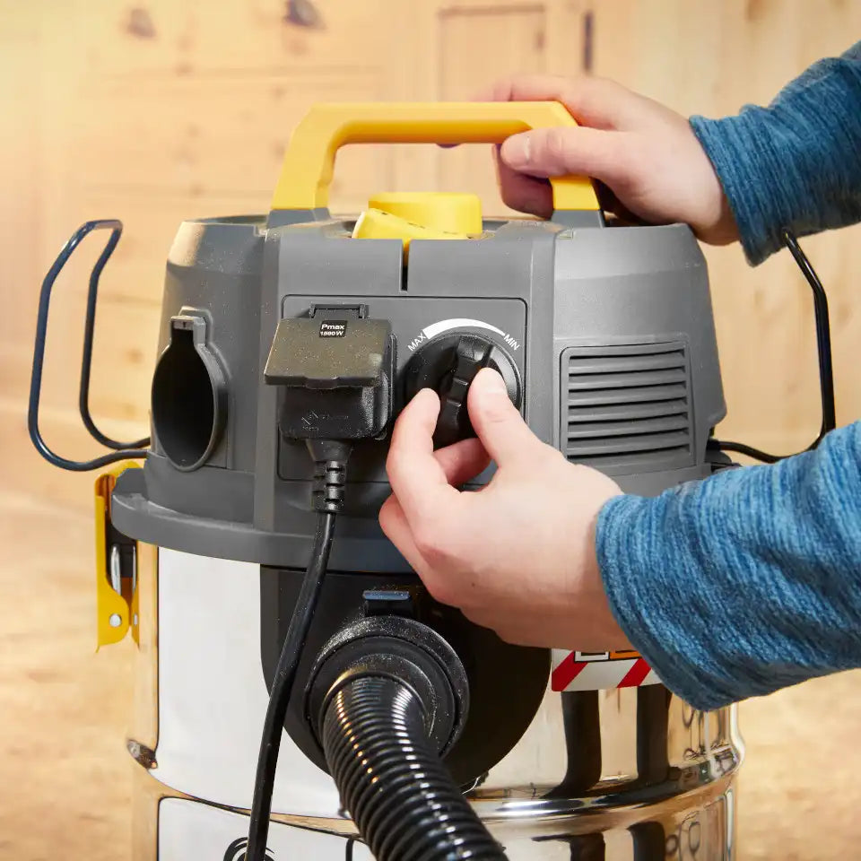 Vacmaster WD L30 Dust Extractor with its variable speed setting feature being used by a workman