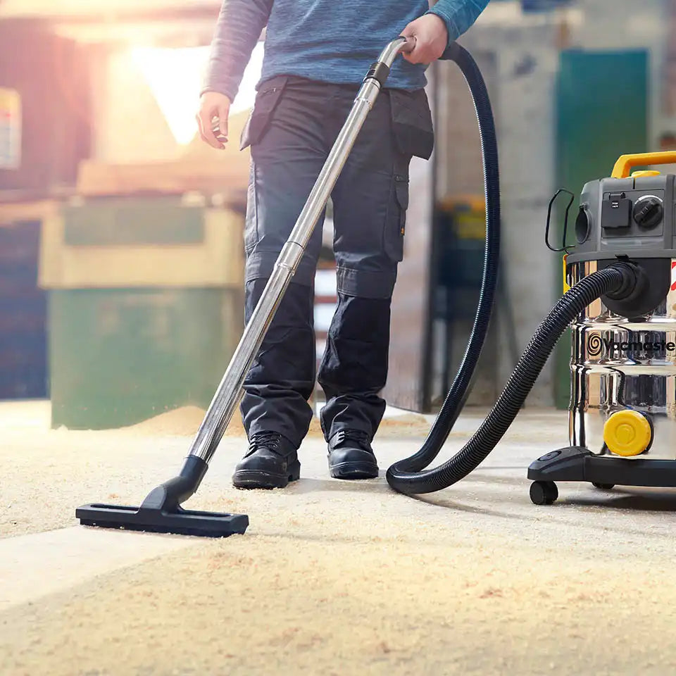 Vacmaster 30L Wet and Dry Dust Extractor being used by tradesman in worksite